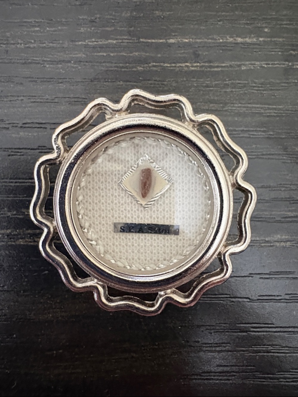 Saint E. A. Seton silver-tone relic pendant